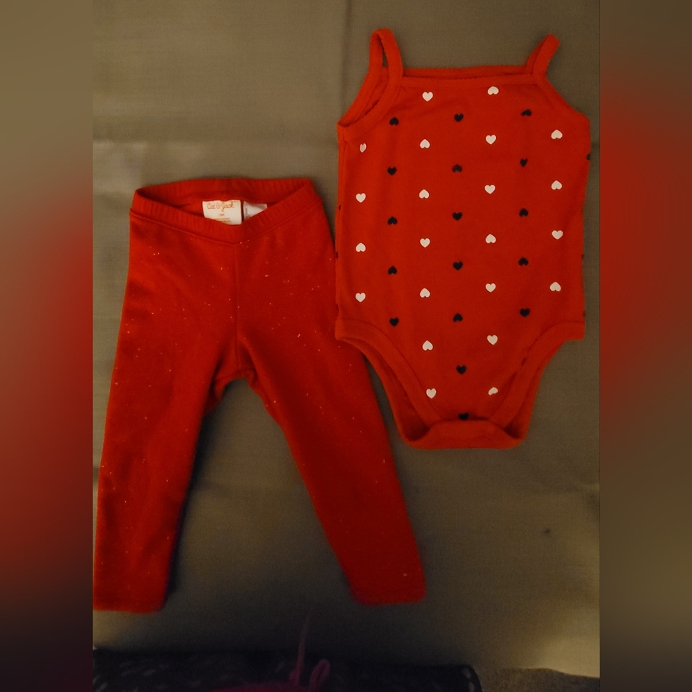 An adorable red onesie and a pair of red toddler stretch pants